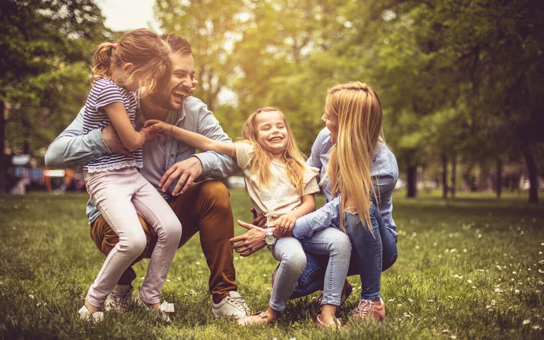 Family playing in a park next to our Cary apartments.